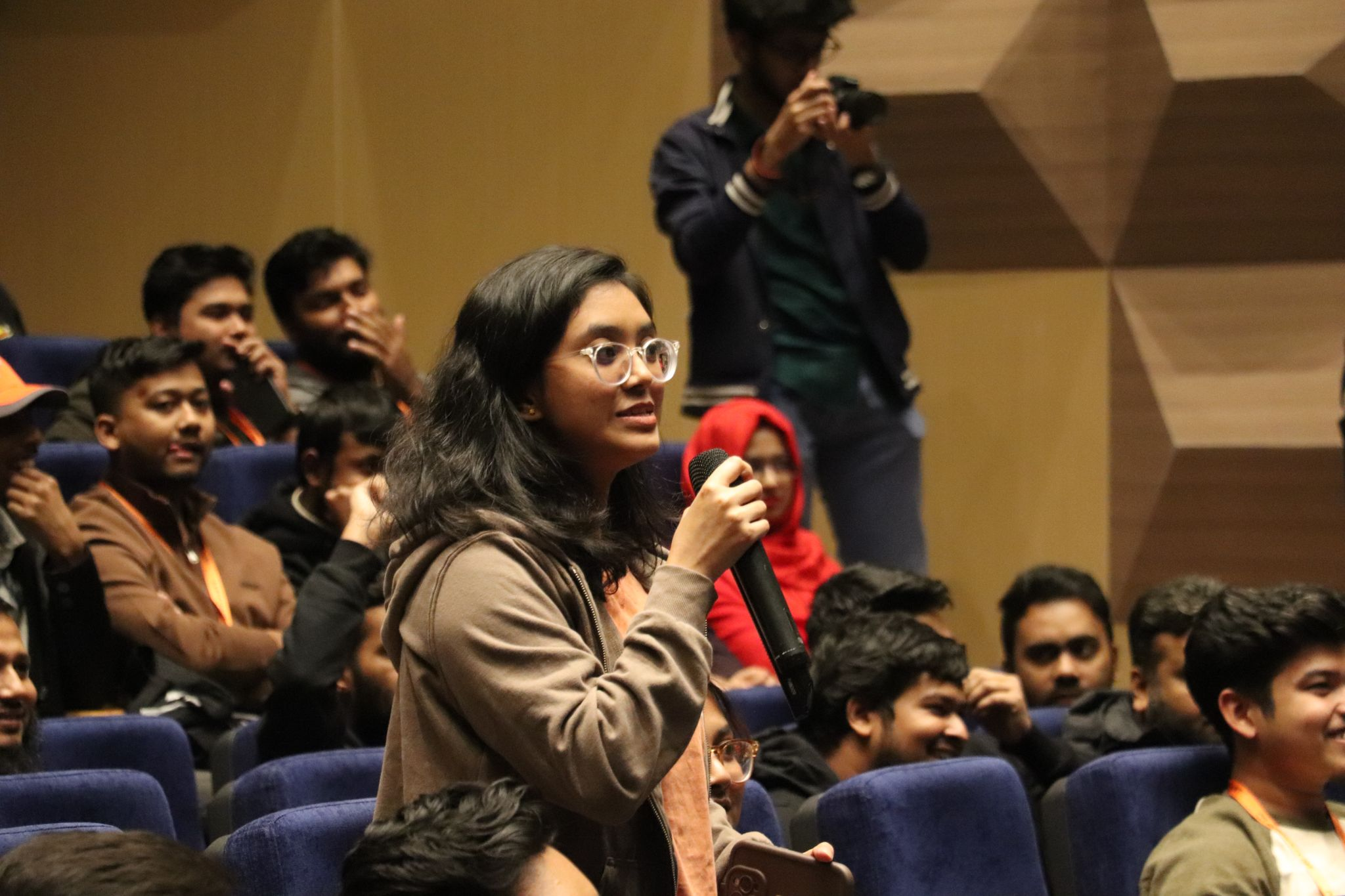 Community member asking a question in the session hall at AWS Community Day Bangladesh 2025